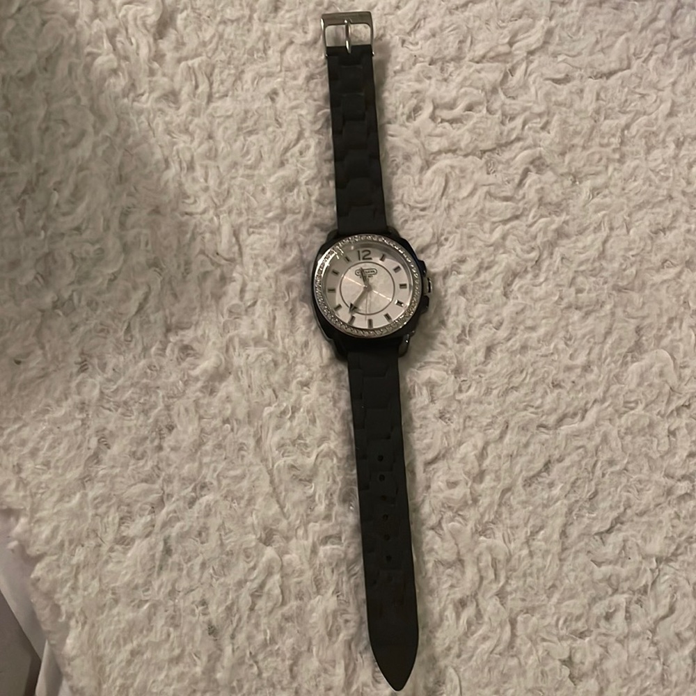 Brand new black on black silicon coach watch. With price still attached.